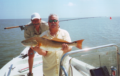 Charley Taylor of Fort Worth, holding redfish, and Tim Deveny successfully fished the Louisiana coast after the Deepwater Horizon oil spill began. Fish_4